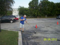 BEITZ Facilitators Emmanuel Tamarez and Rey Lopez paint flagpole base